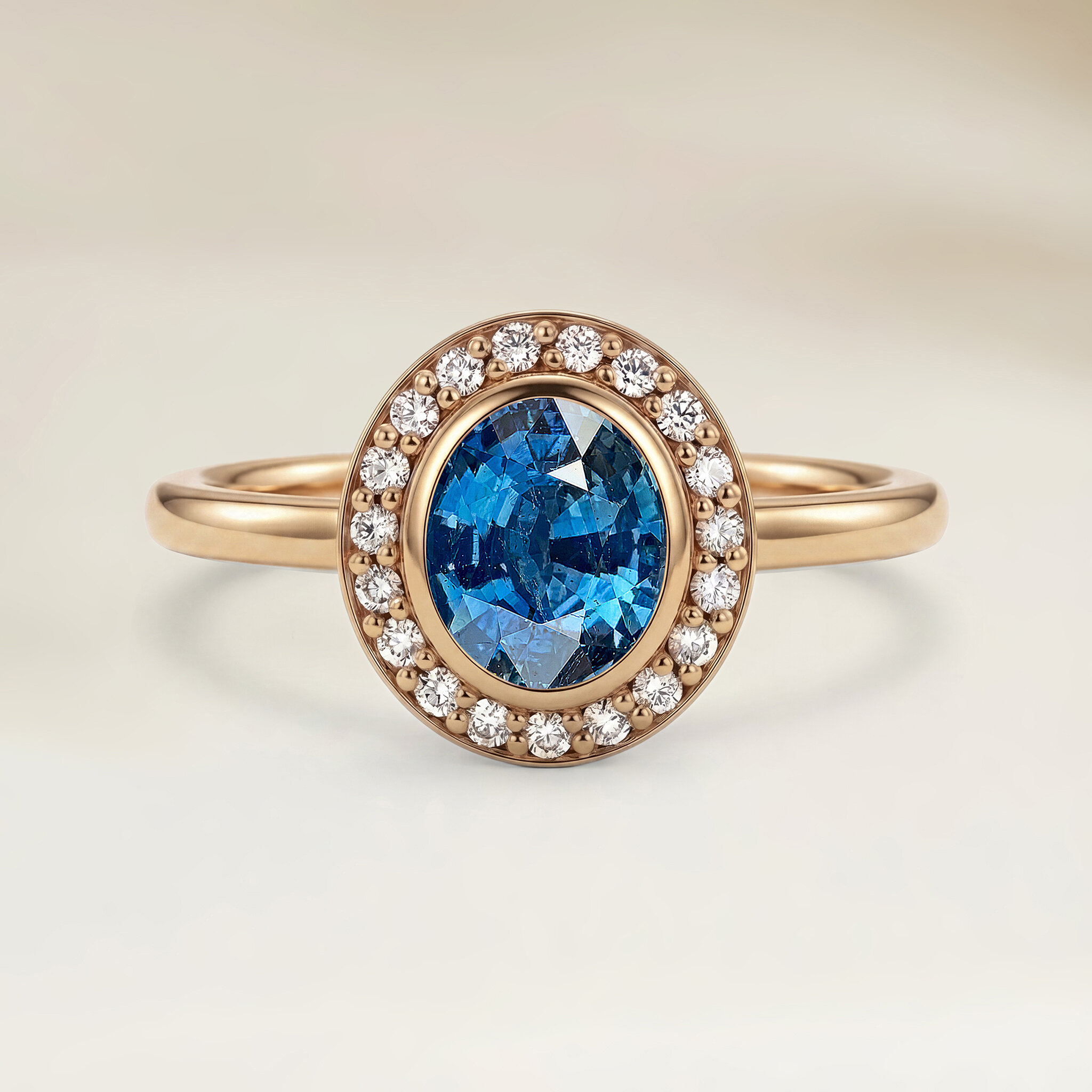 Bague halo saphir bleu or rose
